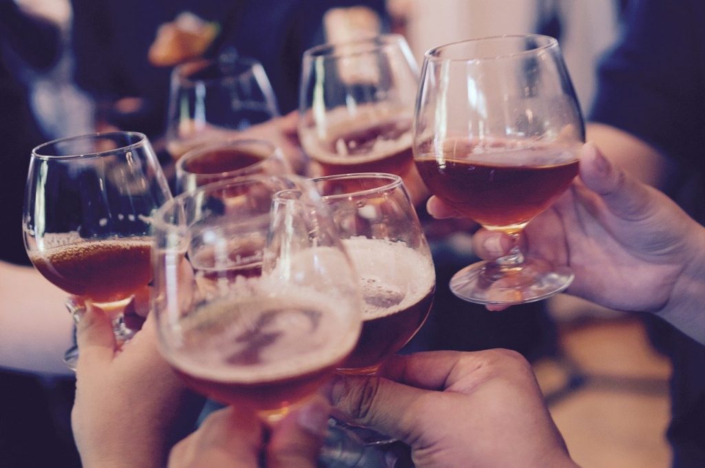 a group of people holding wine glasses