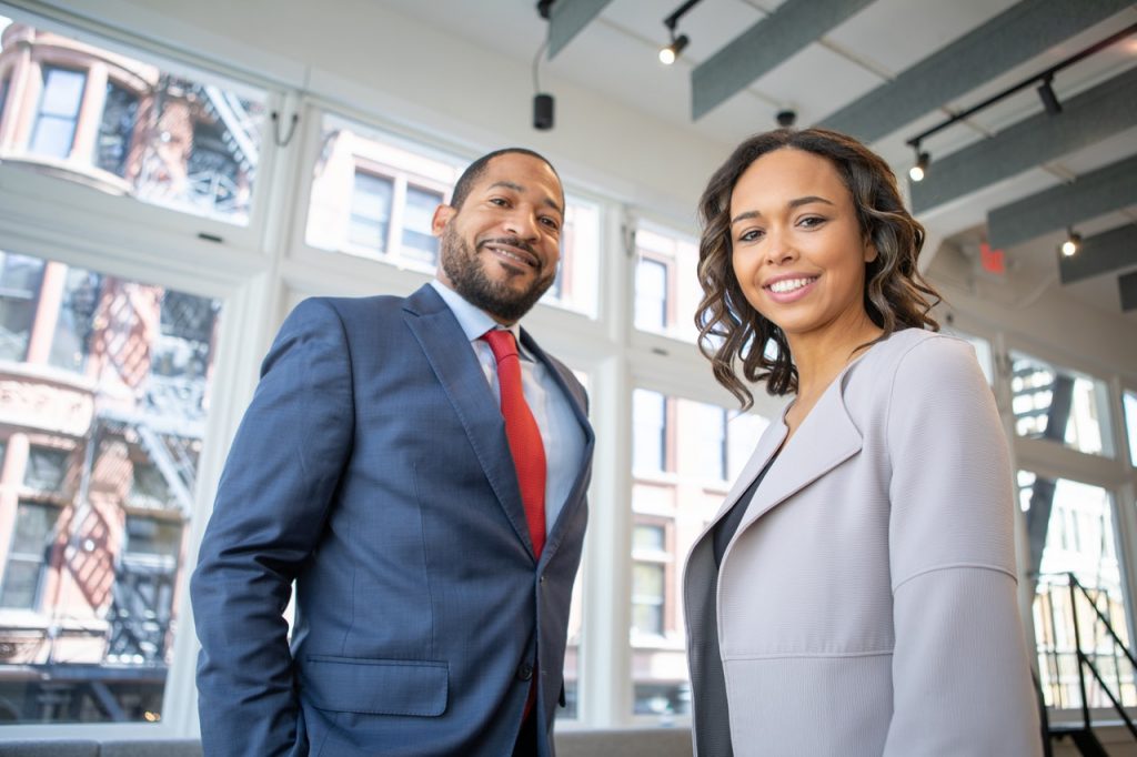 a man and a woman smiling