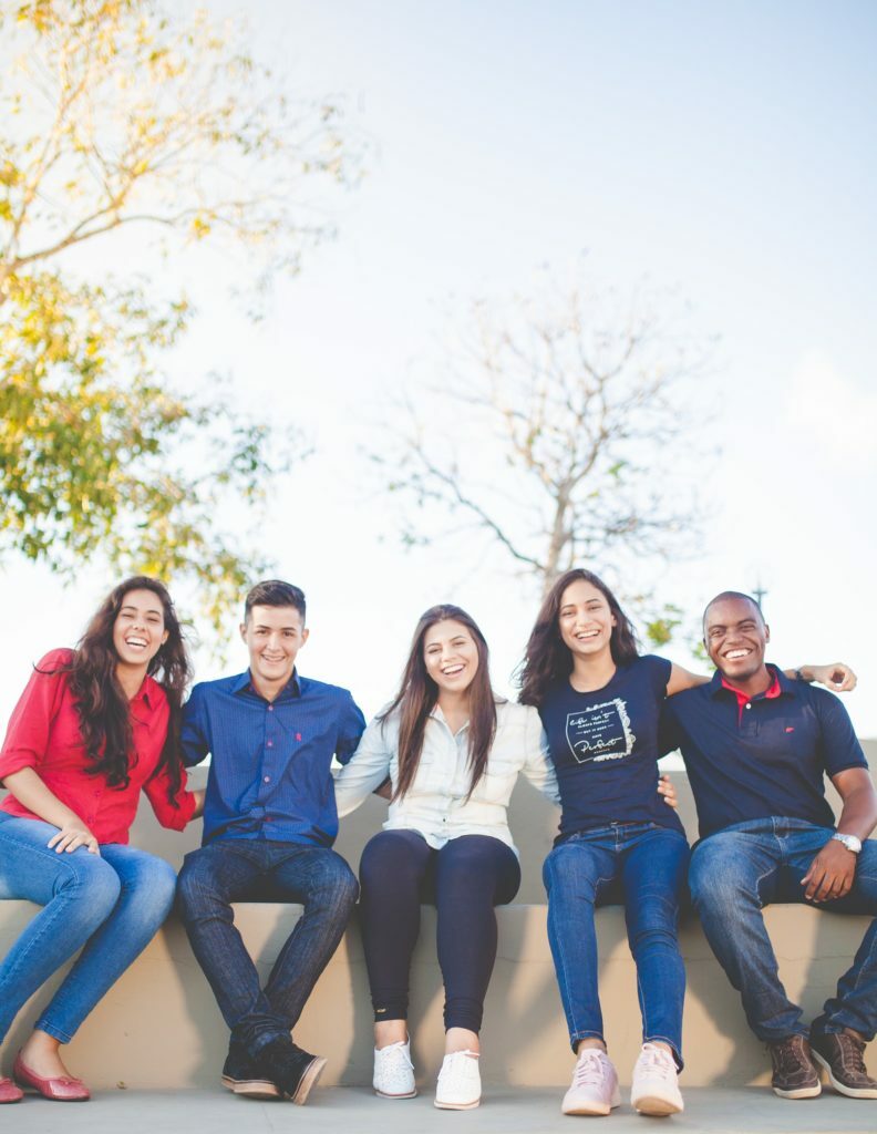 a group of people sitting on a bench