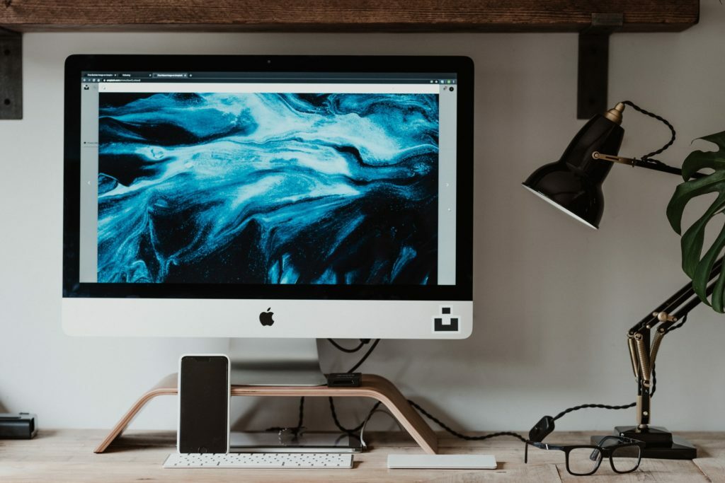 a computer monitor on a desk