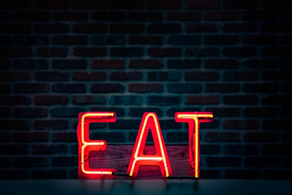 red and black metal letters on a black background