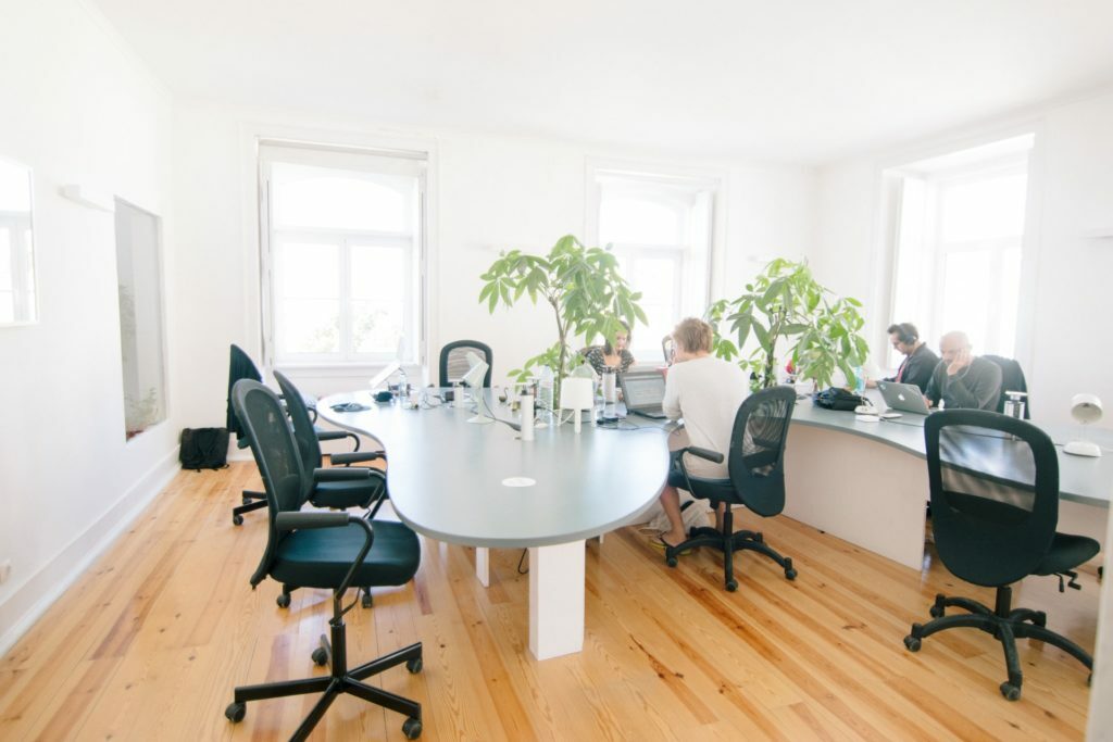 a group of people in a meeting room