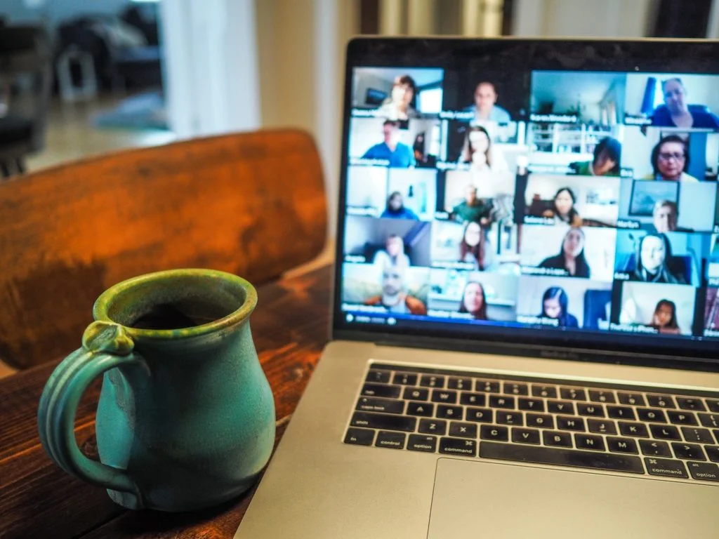 a laptop and a mug on a table