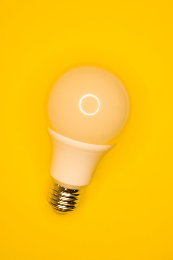 a light bulb on a yellow background