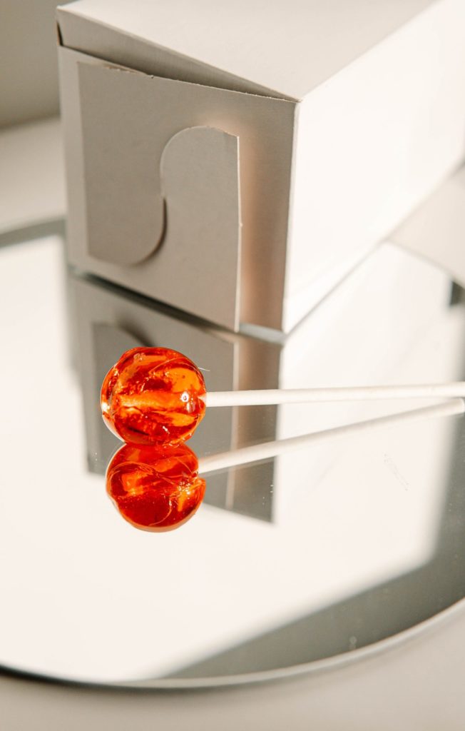 a red pepper in a white container