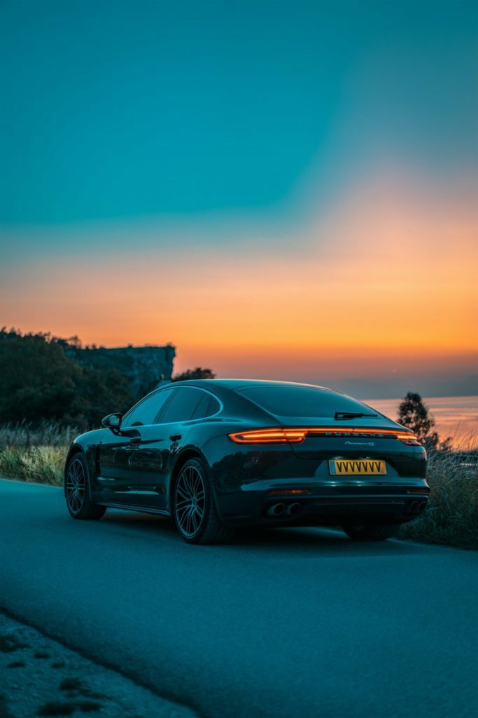 a black car parked on a road