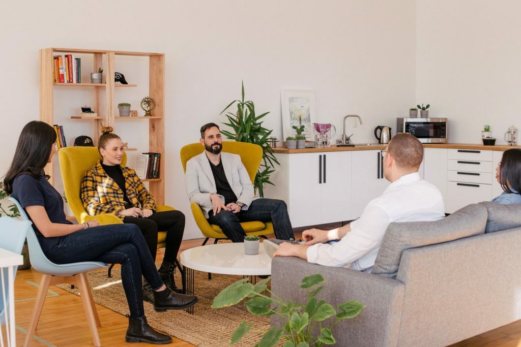 a group of people sitting in a room