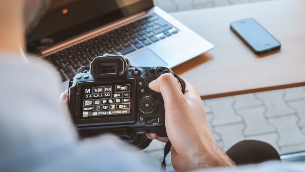 a person holding a camera