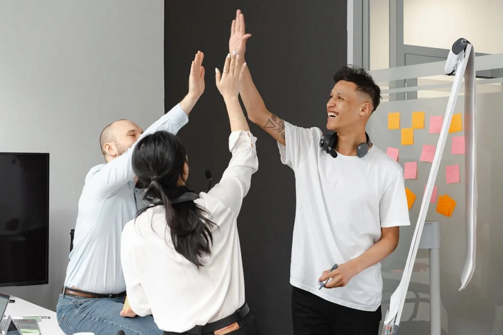 a group of people raising their hands