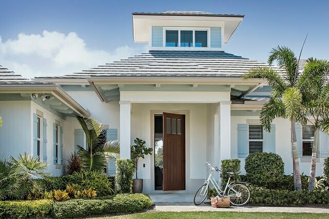 a house with a bicycle parked in front of it