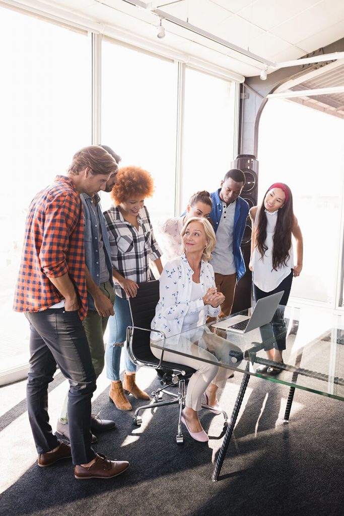 a group of people standing in a room