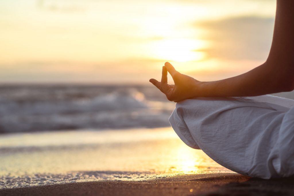 a person sitting on a beach