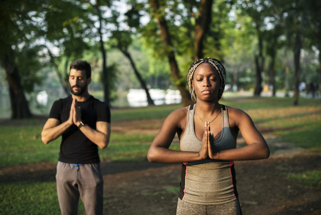 People yoga in a park