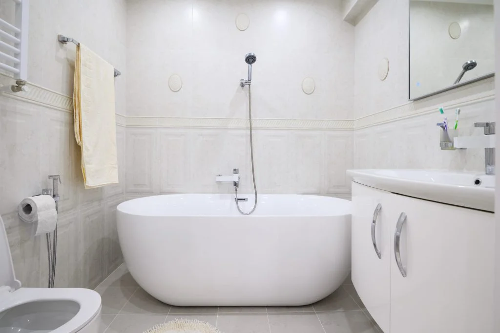 Compact white cozy bathroom with bathub