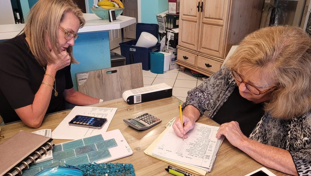 business woman baby boomer interior designer helps       utc scaled