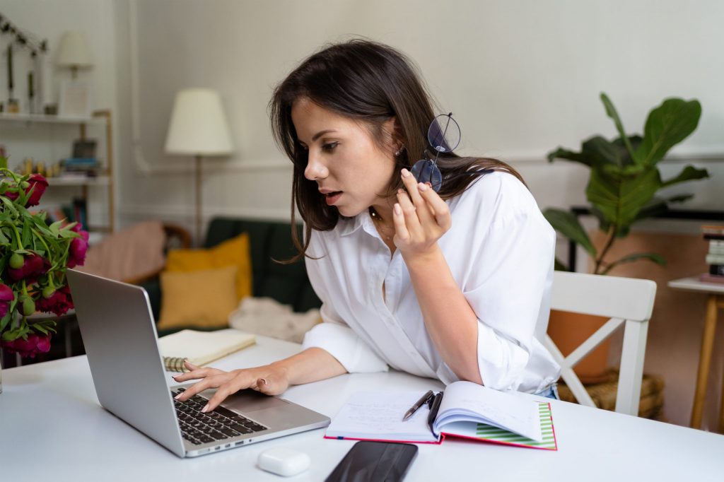 businesswoman working on laptop computer sitting a       utc scaled