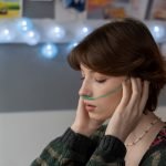 sick teenage girl with oxygen nose pipe touching t       utc scaled
