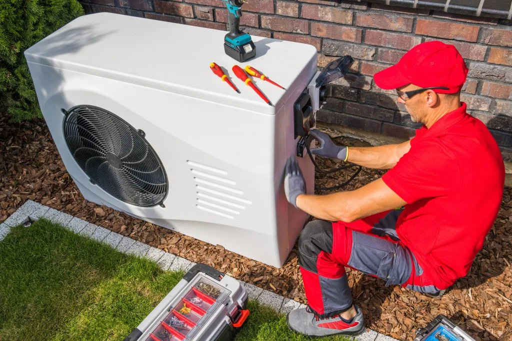 technician repairing heat pump unit       utc scaled