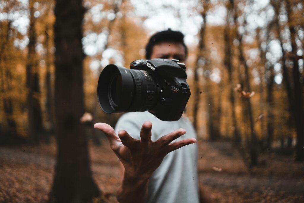 a person holding a camera