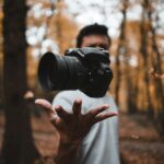 a person holding a camera